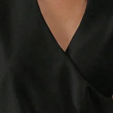 Eleganter einfarbiger Top